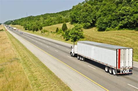 Red Semi Truck Climbing Hill On Interstate Highway Stock Photo Image