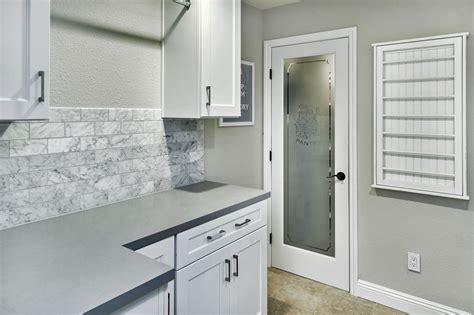 New Laundry Room Omega White Cabinets Grey Quartz Counters Wall