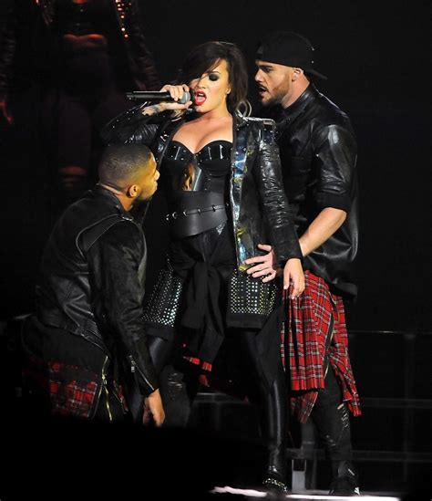 Demi Lovato In Leather Pants And Metal Corset Performing On Stage In