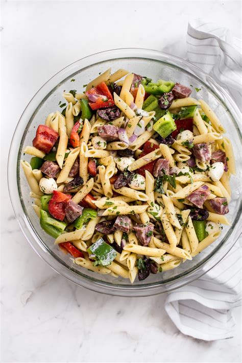Capers, pine nuts, and cranberries—this pasta salad is full of tasty goodies. Easy Italian Pasta Salad Recipe • Salt & Lavender