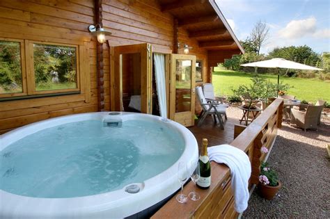 A jacuzzi sits above ground and is movable, offering great versatility and lower build costs. Hop Pickers 2 bedroom luxury log Cabin with private hot ...