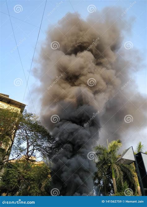 Black Smoke Coming Out Of A Building On Fire Stock Image Image Of