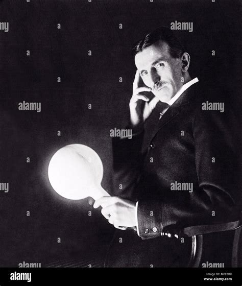 Nicola Tesla With Wireless Electrified Lightbulb Stock Photo Alamy