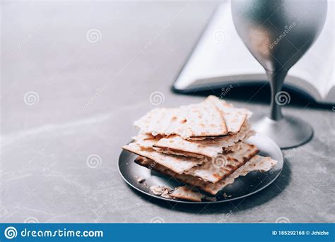 Unleavened Bread Chalice Of Wine Holy Bible On Grey Background