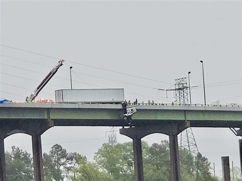 Driver Rescued After Tractor Trailer Cab Goes Off Side Of Bridge In