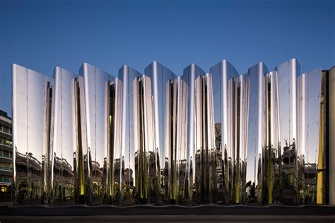 This New Museum Is Wrapped In A Wavy Facade Of Reflective Stainless Steel