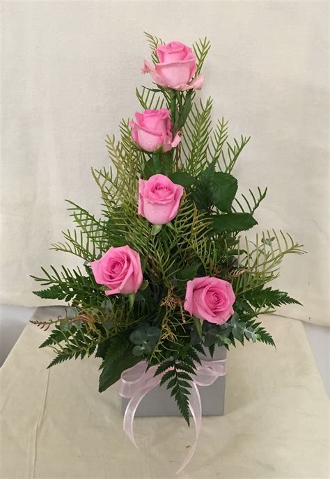 This Arrangement Is Made With Pink Roses Leather Leaf Fern And Parlor