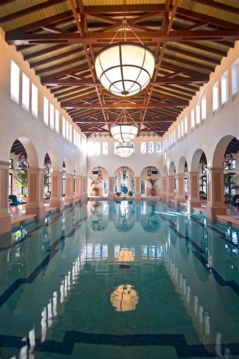An Indoor Swimming Pool In A Large Building