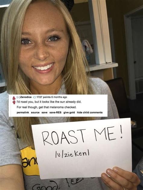 A Woman Is Holding Up A Sign That Says Roast Me In Front Of Her Face