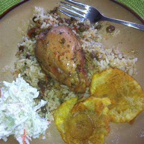 guandules and rice cooked in coconut milk stewed chicken fried plantains and cole slaw