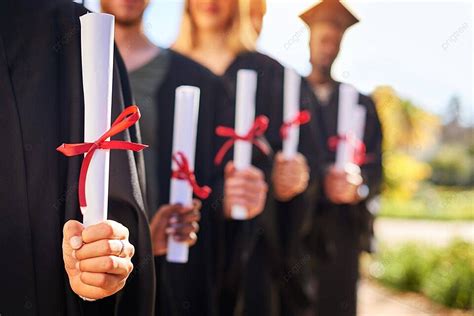 Graduates With Diplomas Ready To Change The World Photo Background And