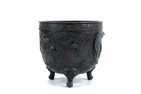 A Large Japanese Bronze Relief Decorated Jardiniere With A Dragon And Phoenix Meiji 19th C
