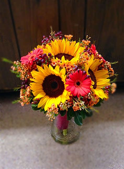 Continuously wrap your bouquet with floral tape as you add flowers (tip: Fall bridal bouquet with sunflowers, gerber daisies, wax ...