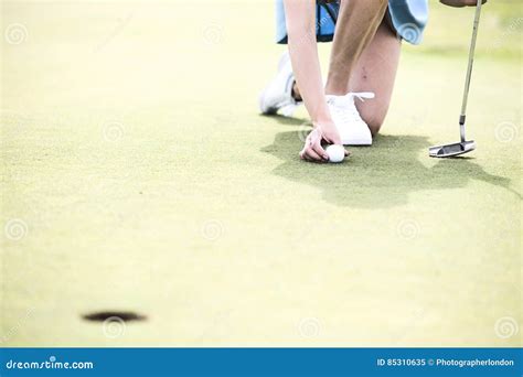 Low Section Of Woman Placing Ball At Golf Course Stock Image Image Of Caucasian Feet 85310635