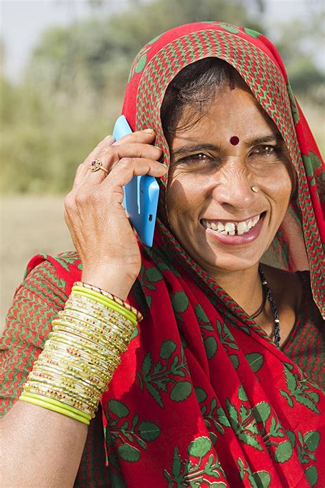 Close Up Indian Rural Villager Woman Talking On Mobile Phone Field