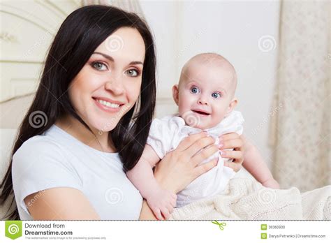 Happy Smiling Mother With Six Month Old Baby Girl Stock Photo Image