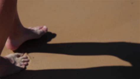 Legs Of Girl Walking Barefoot Along Wet Sand Stock Footage Sbv