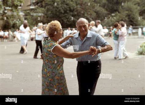 Old Couple Dancing At An Outdoor Tea Dance In The Park Stock Photo Alamy