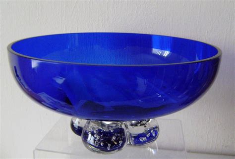 Maybe you would like to learn more about one of these? vintage art glass fruit bowl cobalt blue dump glass foot ...