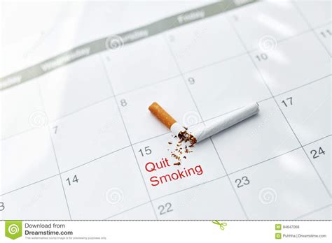 Quit Smoking Close Up Of Broken Cigarette Lying On Calendar Stock