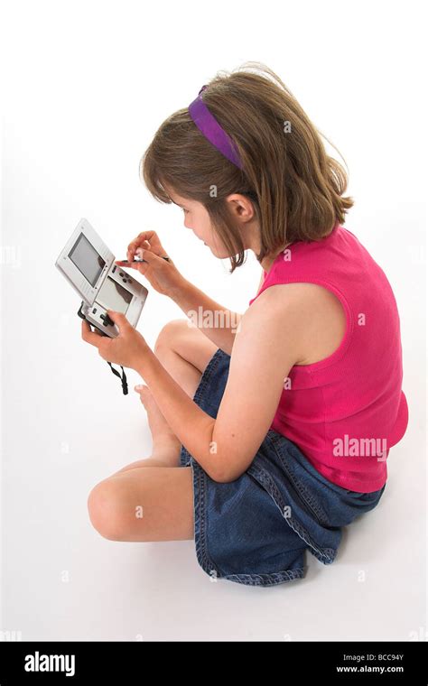 Young Girl Playing On A Nintendo Ds Stock Photo Alamy