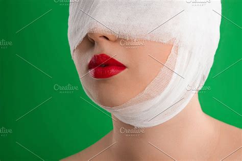 A Bandage On Her Head Containing Human Medical And Head Bandage