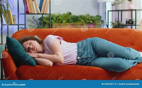 tired lazy woman enjoy relaxing on home sofa resting napping after hard working day closed her