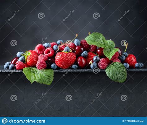 Berries Closeup Colorful Assorted Mix On A Dark Stone Background Stock