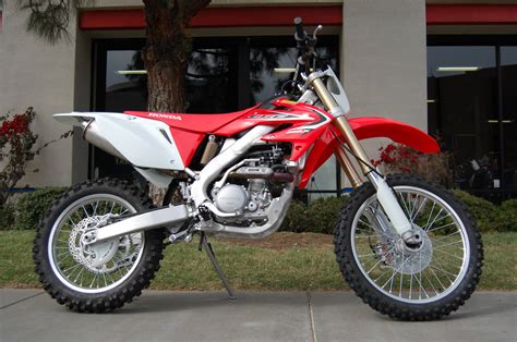 Removing this should not change the performance of the bike, but it will lighten it by 13.25 ounces in my case. 2007 Honda CRF 250 X: pics, specs and information ...