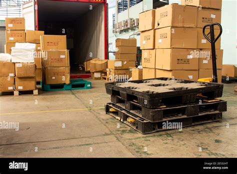 The Cartons With Loading Out Of Container Stock Photo Alamy