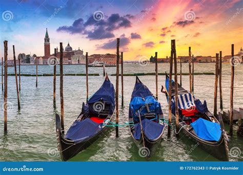 Venetian Gondolas At The Harbor And San Giorgio Maggiore Island At