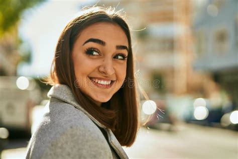 Young Hispanic Girl Smiling Happy Standing At The City Stock Image