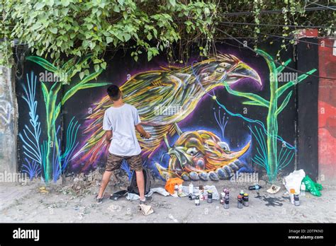 A Street Artist Doing A Wall Mural In Cebu City Philippines Stock