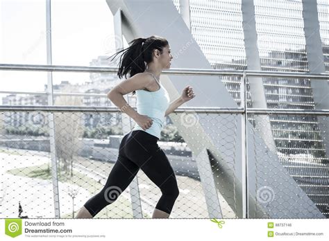 Young Beautiful Athletic Sport Woman Running And Jogging Crossing