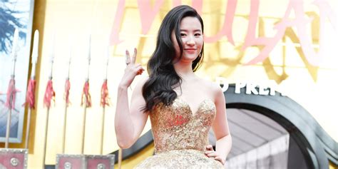Liu Yifei Wears Giant Gold Elie Saab Gown To La Mulan Premiere