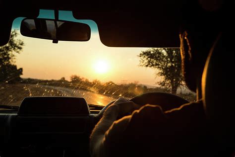 Man Driving Car At Sunset Photograph By Alexandra Simone
