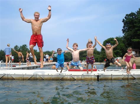 Summer Camp Having Fun On Floating Dock Summercamp Lakelife