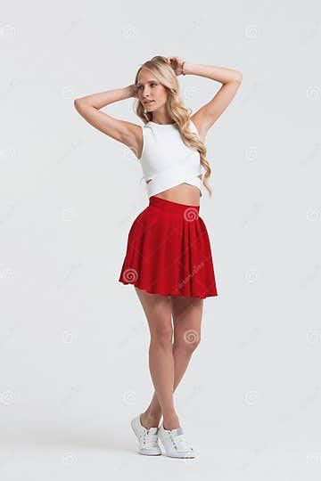 girl with perfect body in red skirt on a white background stock image image of attractive
