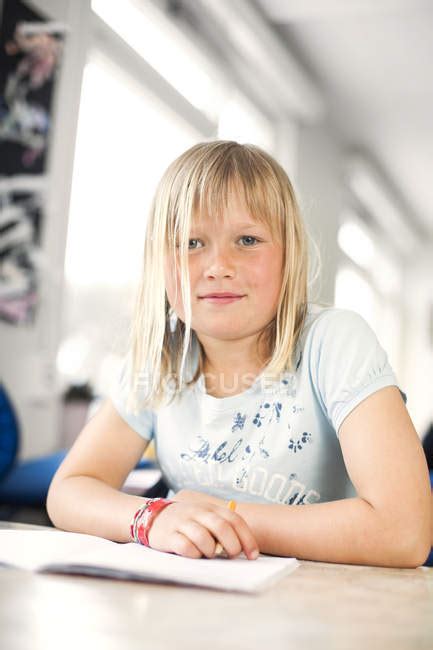 Cute Girl Sitting At Desk — Intelligence Front View Stock Photo