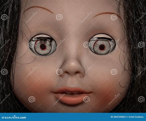 Creepy Scary Old Vintage Doll Face With Black Hair Smiling Stock Image