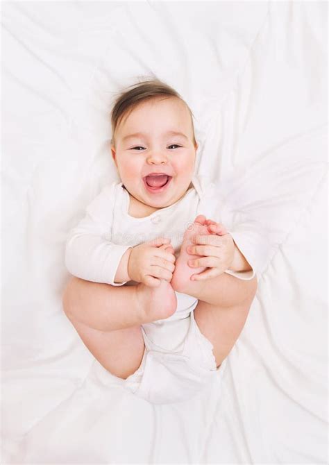 Laughing Baby Lies On The Bed Stock Image Image Of Funny Face 63753189