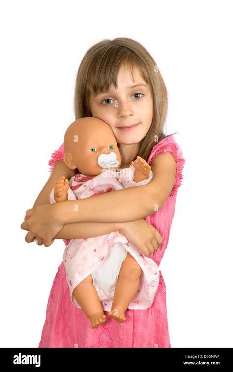The Smiling Little Girl Embraces A Doll Stock Photo Alamy