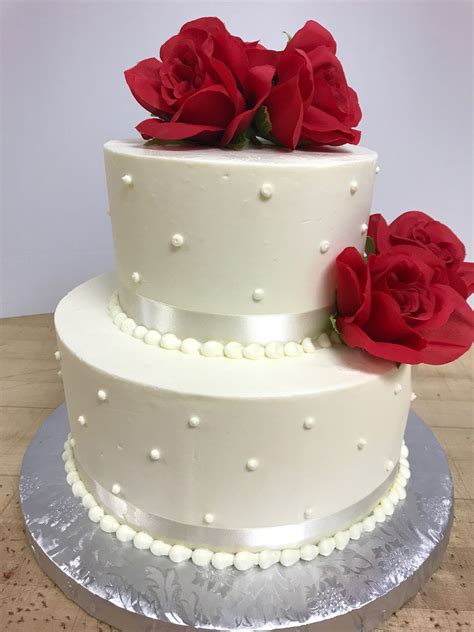 2 Tiered White Cake With Pearl Decoration White Ribbon And Red Roses