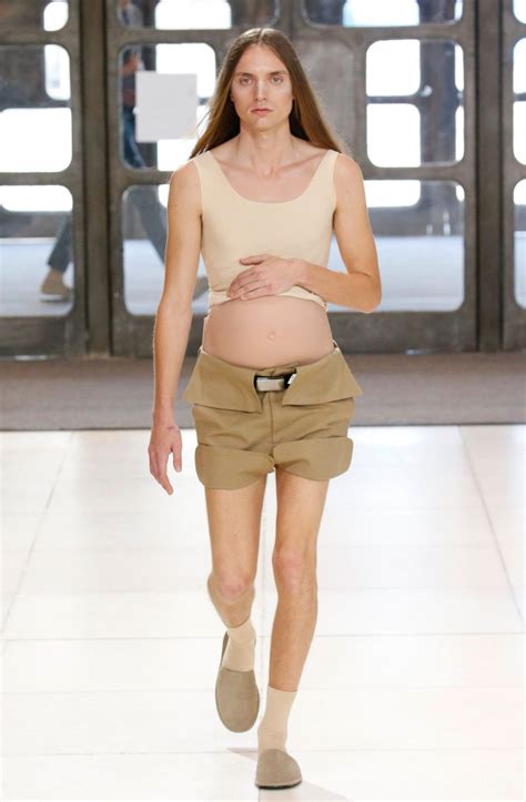 a bunch of male models walked the runway with fake pregnant bellies
