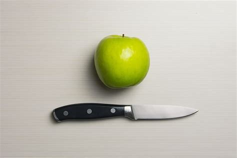 Green Apple Beside Silver Bladed Knife Apple Blade Cutting Tool
