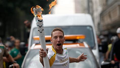 Olympic Torch Relay Moves On In Style Olympic Torch Olympic Flame