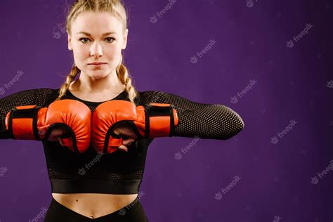 Premium Photo Sports Young Woman Wearing Boxing Gloves On Color