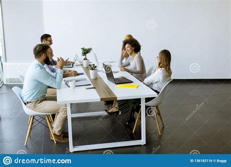 Joyful Multiracial Business Team At Work In Modern Office Stock Photo