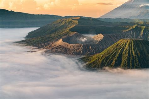 Free Photo Volcano With Mist At Sunset