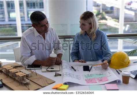 Front View Caucasians Architects Discussing Over Stock Photo 1352656064